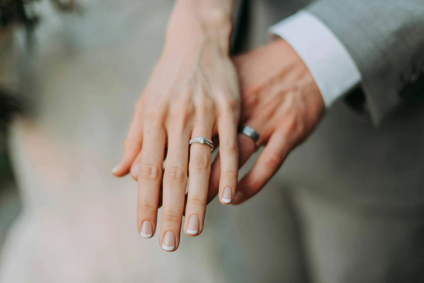 A bride and groom holding hands